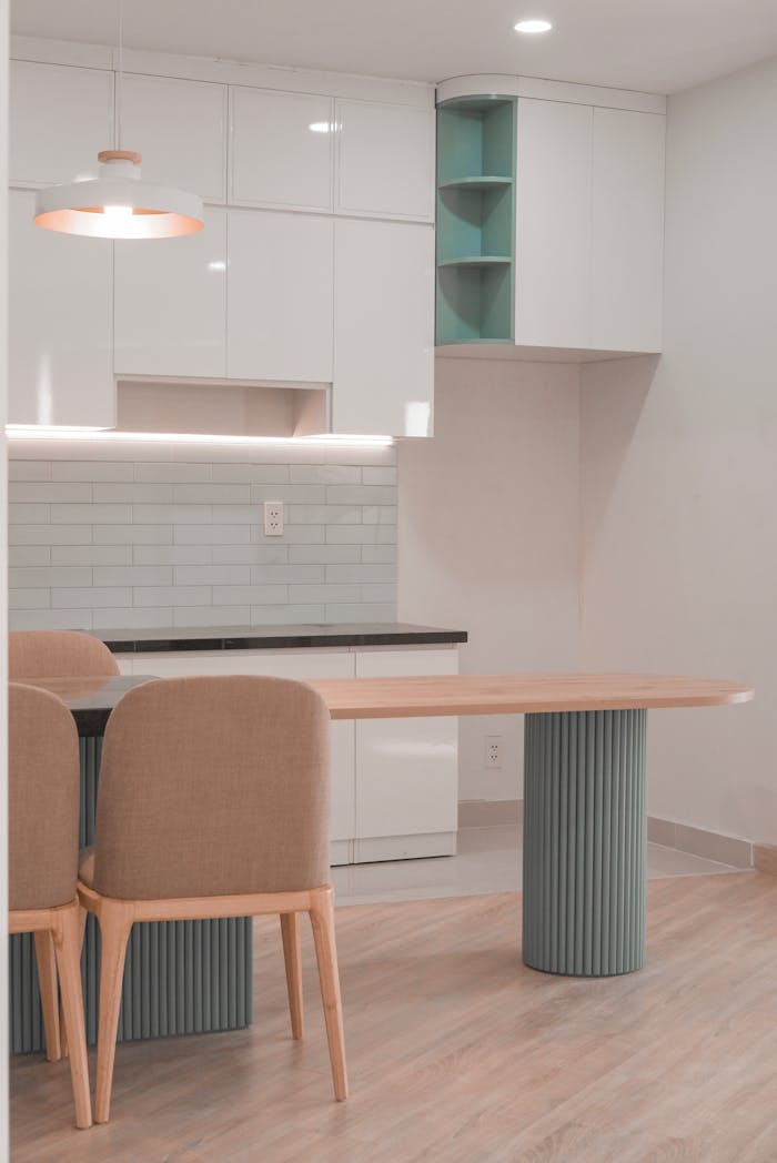 services-01 Stylish modern kitchen with minimalist design featuring sleek furniture and soft lighting.
