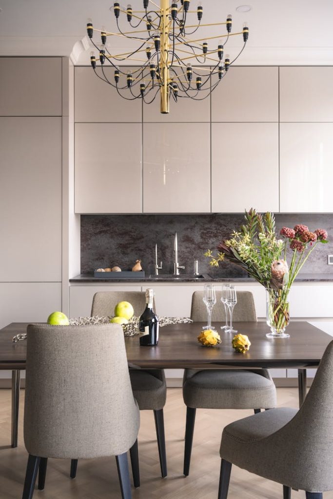 pexels photo 8662032 Sophisticated dining area featuring a wooden table, chic chairs, and stylish decor.